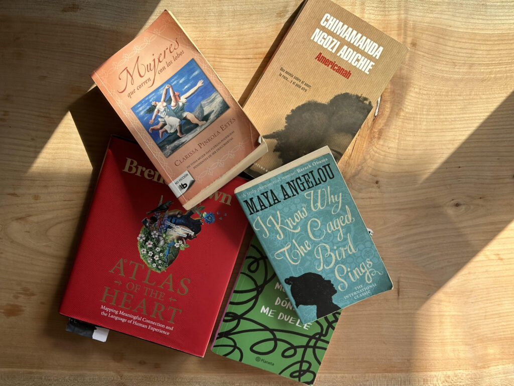 5 books laying on a living room table